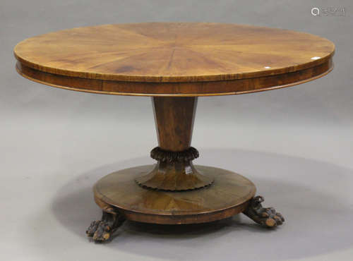 A mid-Victorian figured mahogany tip-top breakfast table, the radially-veneered top above a tapering