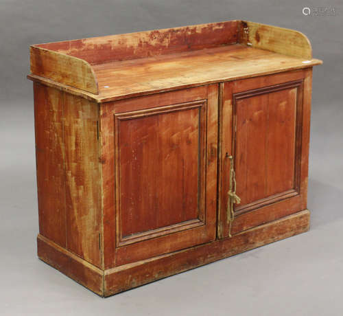 A 19th century pine side cupboard with galleried top, height 87cm, width 114cm, depth 50cm, together