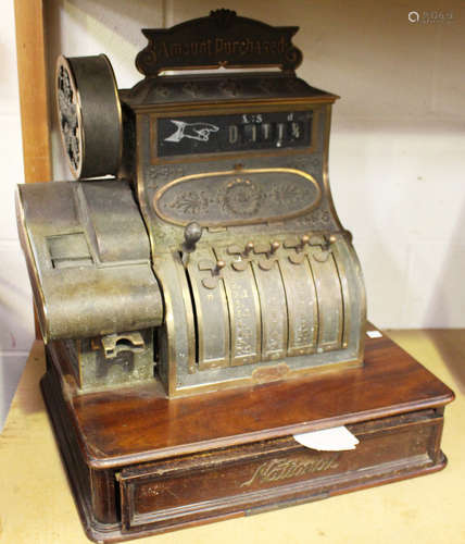 An early 20th century cast brass National cash register, the case bearing cast serial number '