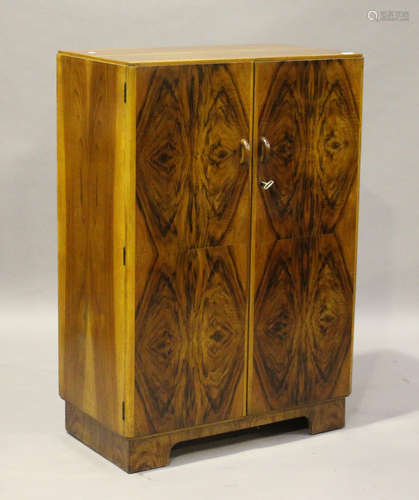 A small Art Deco walnut gentleman's compactum wardrobe, the interior fitted with a hanging rail