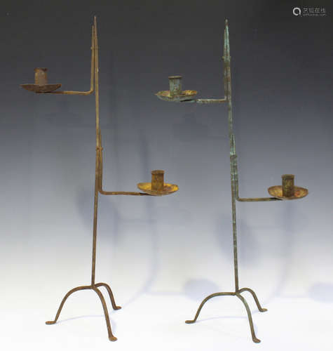 A pair of 20th century wrought iron rush light candle stands, height 70cm, together with a wrought