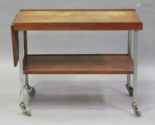 A mid-20th century teak and painted steel two-tier trolley with drop-flap extending end, height