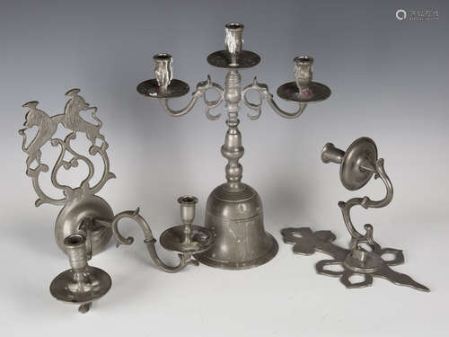 A 20th century pewter three-light candelabrum, height 39.5cm, together with a group of pewter wall