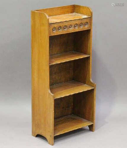 An early 20th century pale oak narrow dwarf open bookcase, fitted with a single drawer, height 86cm,