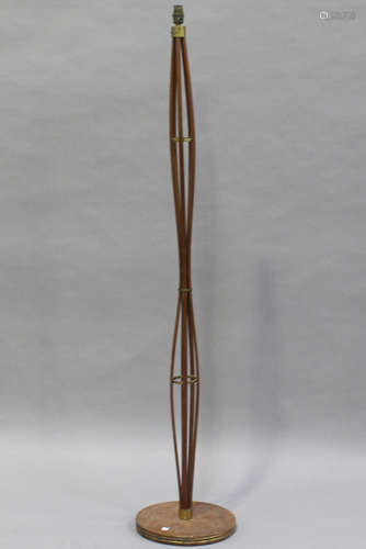 A mid-20th century teak and brass mounted lamp standard, height 158cm.Buyer’s Premium 29.4% (