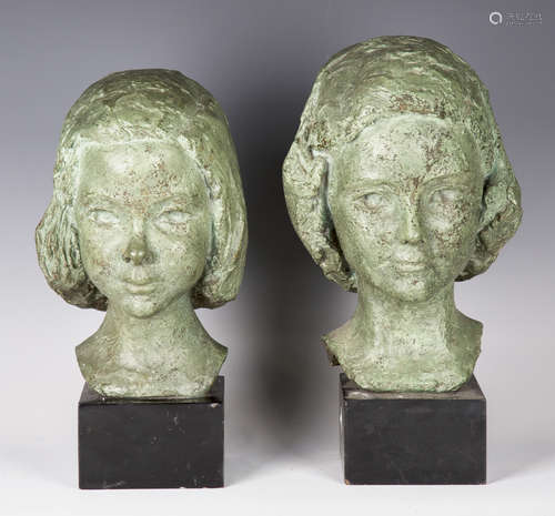 Two 20th century green patinated cast bronze busts of young girls, both mounted on ebonized bases,