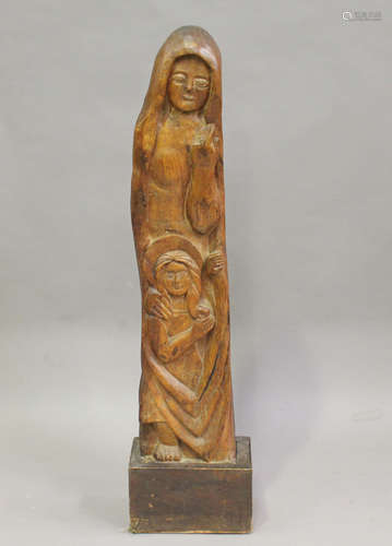 A 20th century carved hardwood figure group, modelled as the Madonna and Child, mounted on a