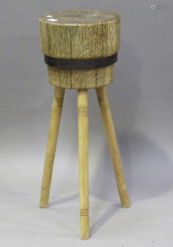 A late 19th/early 20th century Continental oak and beech chopping block, on turned legs, height