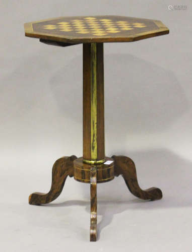 A Regency rosewood octagonal games table, the crossbanded top inlaid with a maple and rosewood
