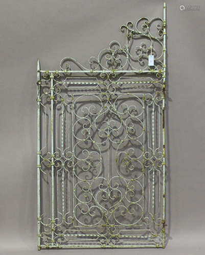 A 19th century green painted wrought iron single gate of scrollwork form, height 170cm, width 87cm.