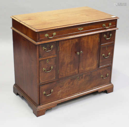 A George III and later mahogany side cabinet, fitted with a central cupboard and six drawers, height