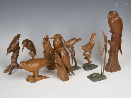 A group of eight mid/late 20th century carved wooden models of birds, each finely modelled