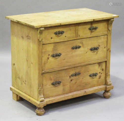A 20th century Continental stripped pine chest of two short and two long drawers, on bun feet,