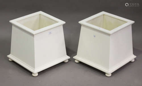 A pair of 20th century white painted wooden plant pot holders of square section, height 36cm,