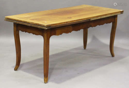 A 19th century French cherry draw-leaf farmhouse table, with a shaped apron and cabriole legs,
