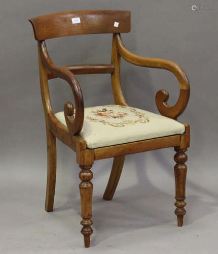 A Regency mahogany bar back elbow chair with a drop-in needlework seat, height 85cm, width 53cm.