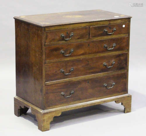A George III mahogany fan inlaid and crossbanded chest of two short and three long drawers, on