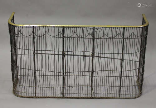 A 19th century wirework nursery fireguard, the top with brass trim, height 60cm, width 105cm.Buyer’s