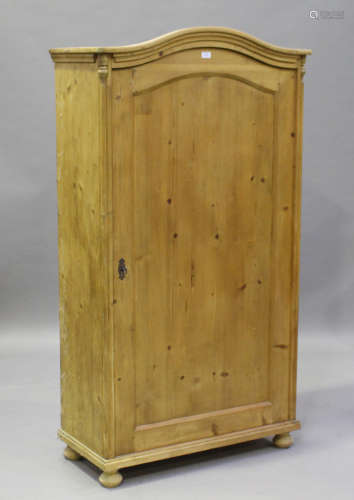 A late 19th century Continental stripped pine arched wardrobe with single door, height 170cm,