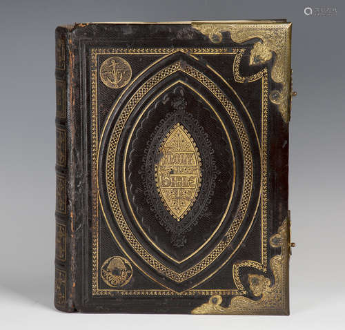 A Victorian gilt tooled and embossed leather Holy Bible with gilt metal corner mounts and clasps,