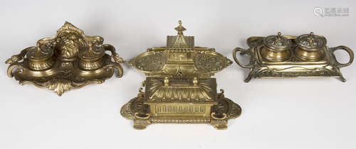 An Art Nouveau cast brass twin-handled inkstand, width 26.5cm, together with three other cast