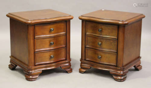 A pair of modern French style serpentine-fronted bedside chests, on ogee bracket feet, height