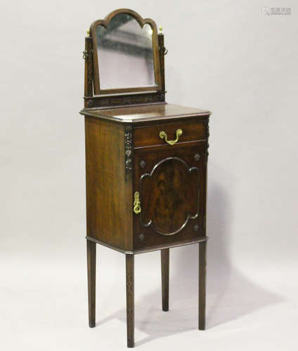 An Edwardian mahogany dressing cabinet with blind fretwork and foliate carved decoration, height