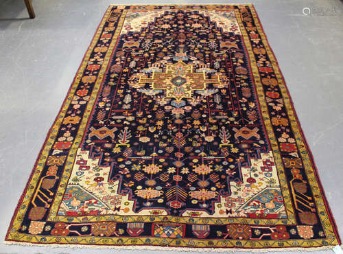 A Sarough rug, Central Persia, mid/late 20th century, the midnight blue field with an angular