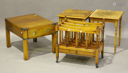 A group of late 20th century reproduction yew furniture, comprising two campaign style coffee