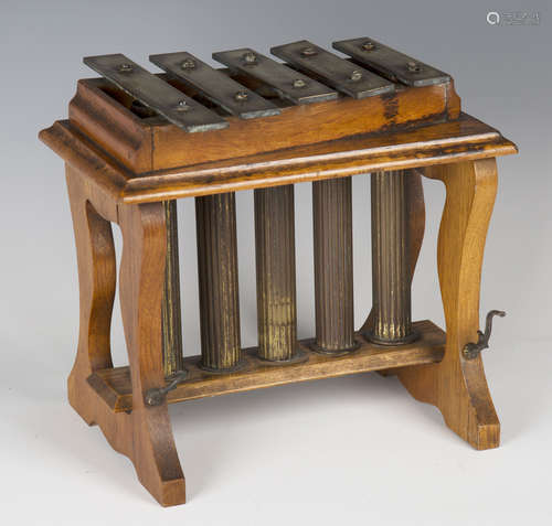 An early 20th century oak framed glockenspiel, on shaped supports, width 29cm.Buyer’s Premium 29.