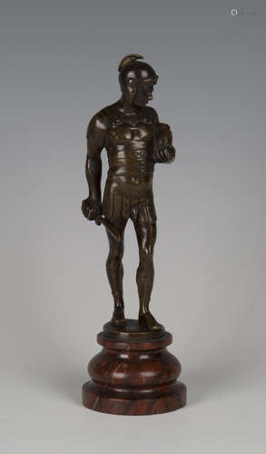 A late 19th century Continental brown patinated cast bronze figure of a Roman soldier holding a