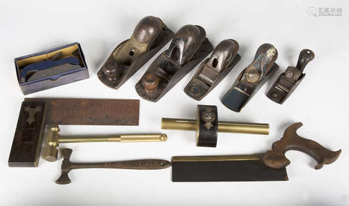 A collection of woodworking tools, including two Stanley planes, numbers 140 and 110, a Record