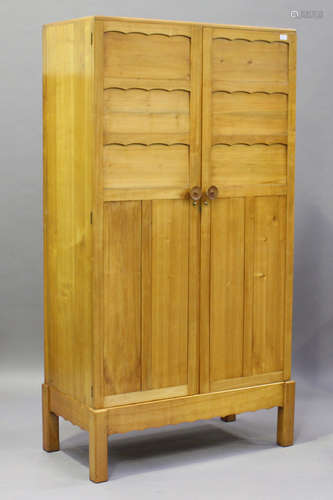 A pair of 20th century cherry wood graduated wardrobes, both fitted with panelled doors enclosing