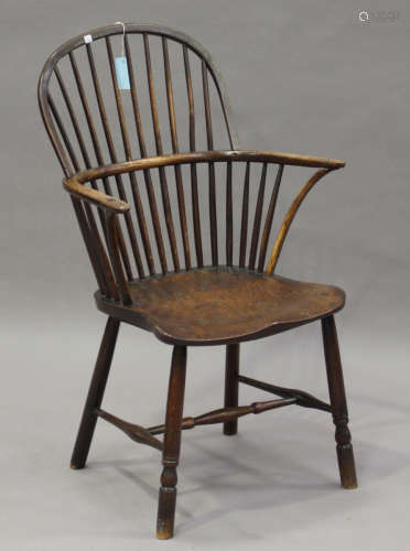 A Victorian ash and elm primitive Windsor armchair, raised on turned legs, height 99cm, width