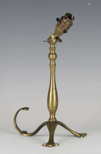 A late Victorian brass table lamp, in the manner of W.A.S. Benson, the adjustable light fitting on a