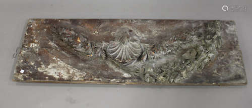 An 18th/19th century carved softwood frieze panel, finely modelled in high relief with a scallop