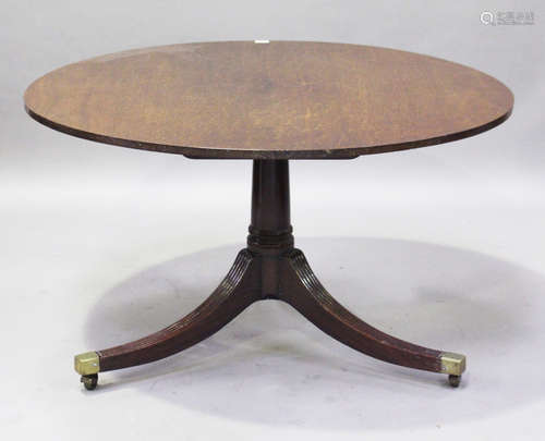 A George III mahogany circular tip-top breakfast table, the three reeded legs with brass caps and