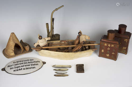 A small group of collectors' items, including a pair of Chinese pewter tea caddies, an Inuit leather