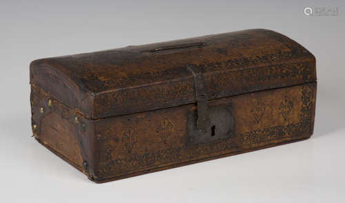 A 19th century Tudor Revival tooled leather domed-top box with handcrafted ironwork and paper-