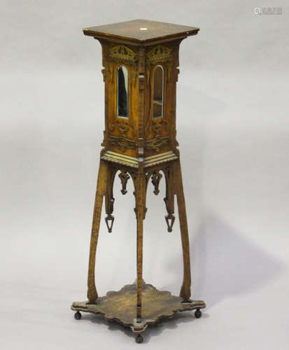 An early 20th century Arts and Crafts oak and softwood display pedestal, the sides with applied