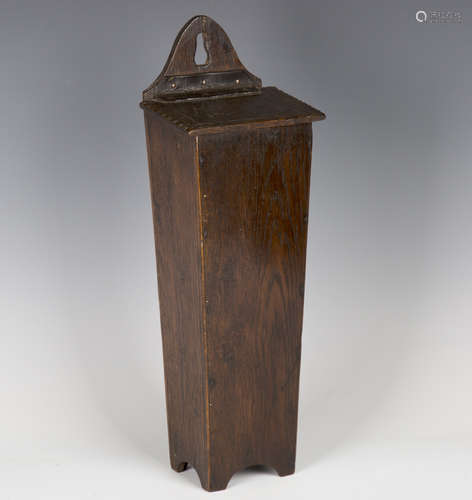 A 19th century provincial oak hanging candle box with leather hinge, height 41cm.Buyer’s Premium