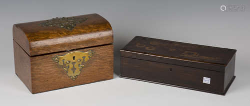 A late Victorian oak and brass mounted dome-topped tea caddy, the interior with twin-lidded