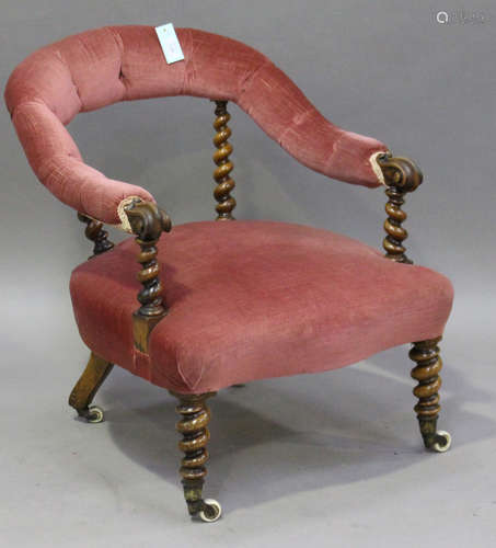 A late Victorian walnut framed nursing chair with barley twist supports, the brass caps stamped '