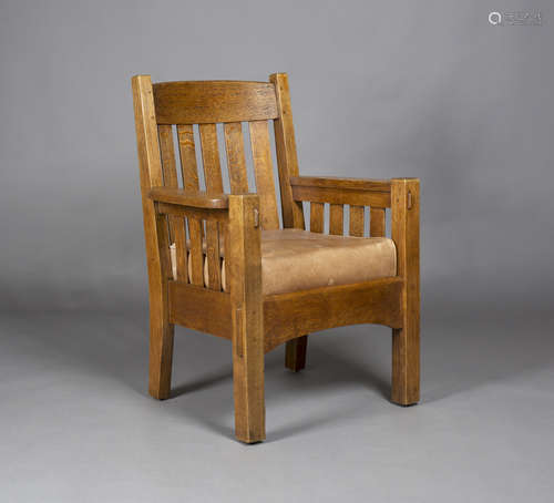 An early 20th century American Mission Arts and Crafts oak framed armchair, probably made by