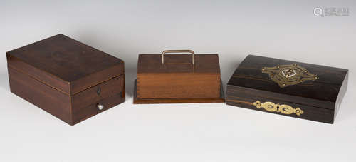 A George III mahogany travelling writing box, the hinged lid enclosing a mirror and various