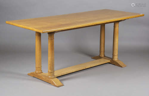 An early 20th century Heals pale oak Letchworth dining table, designed by Philip Tilden, the