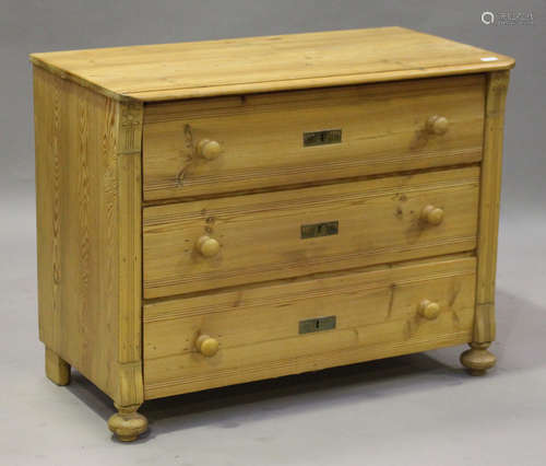 An early 20th century pine chest of three drawers, on bun feet, height 79cm, width 101cm, depth