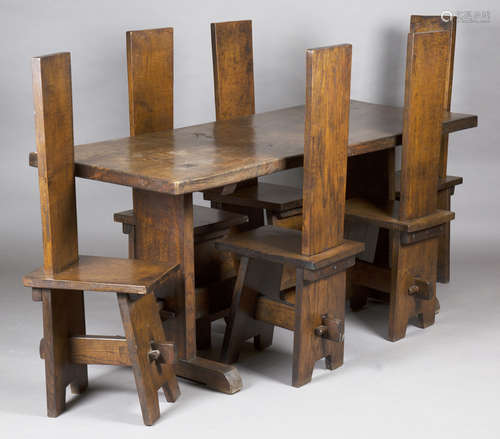 A mid-20th century Arts and Crafts style oak refectory table and six matching chairs, height of