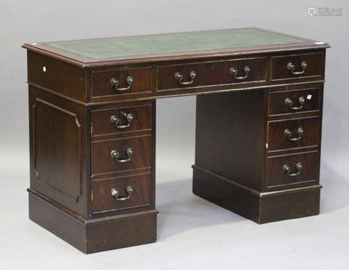 A late 20th century reproduction mahogany twin pedestal desk, the top inset with leather, height