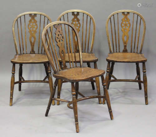 A set of six 20th century ash and elm Windsor chairs, all with crinoline stretchers, comprising four